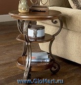 Стол журнальный с круглой столешницей и двумя нижними полочками. Материалы: МДФ, шпон ценных пород дерева, ковка. Цвет: орех.
Размеры: 560х560х660.
