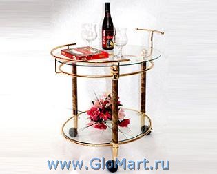 Круглый сервировочный столик из закаленного стекла и металла с покрытием под золото.
